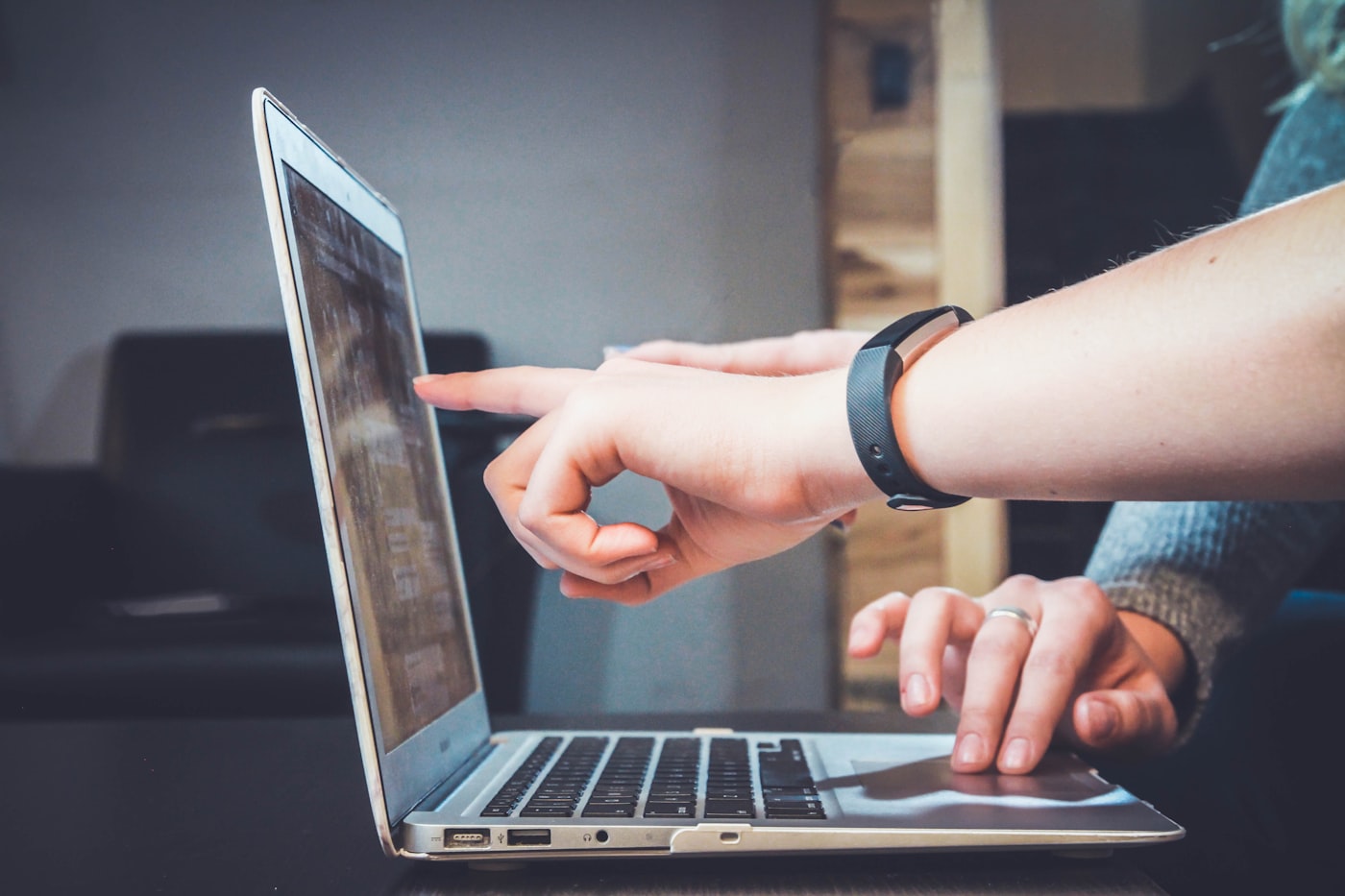 Student attending an online class on a laptop