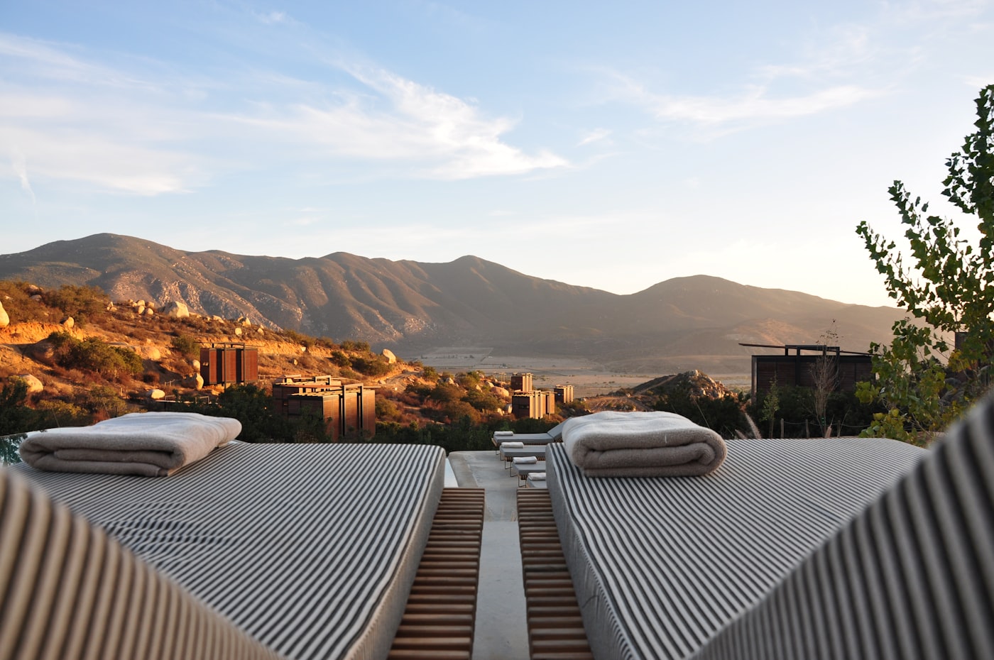 Hotel pool and courtyard area with guests relaxing