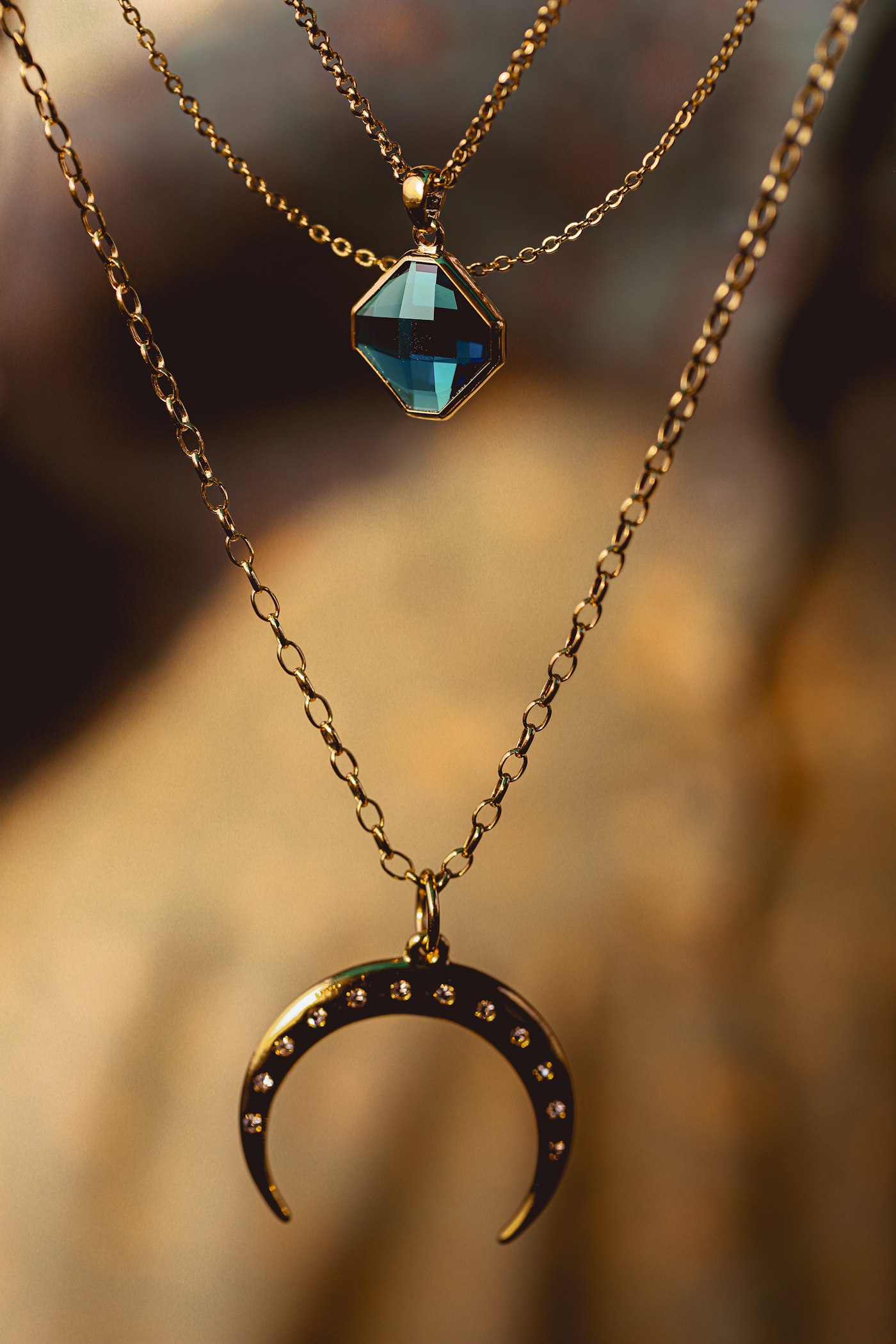 Close-up of handcrafted gold jewellery on display