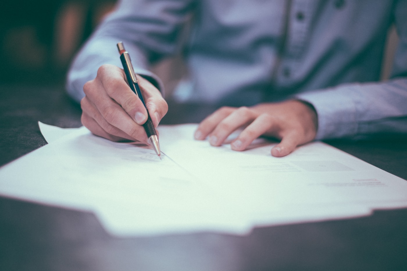 Advocate reviewing case documents at a law office desk