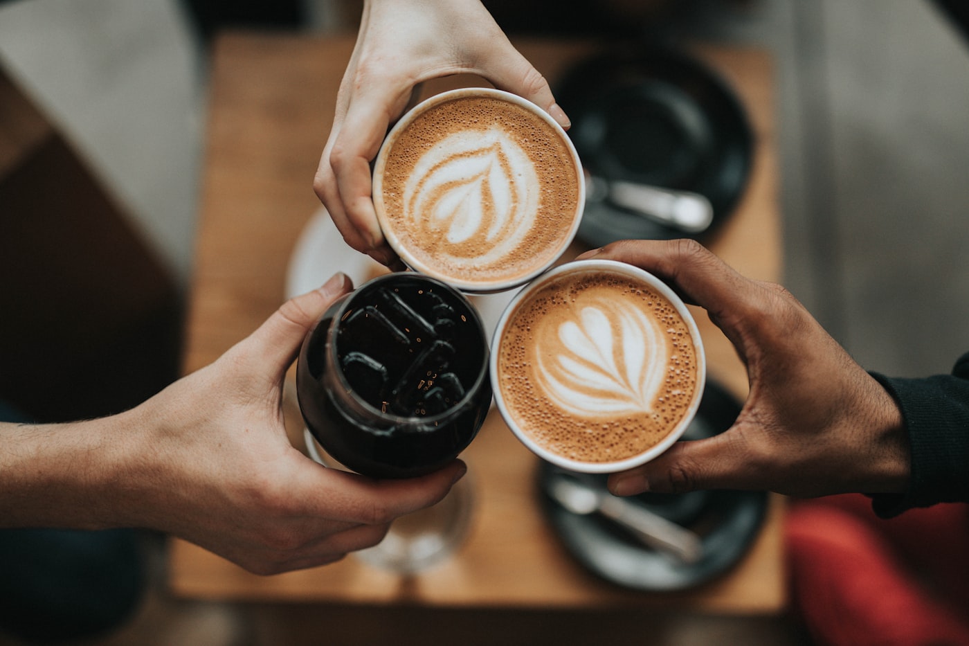 Barista handing over a coffee at the counter