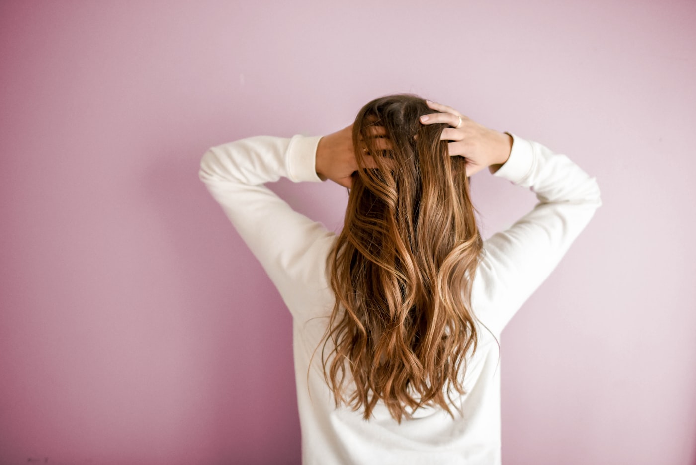 Hairstylist working on a client in a bright, modern salon
