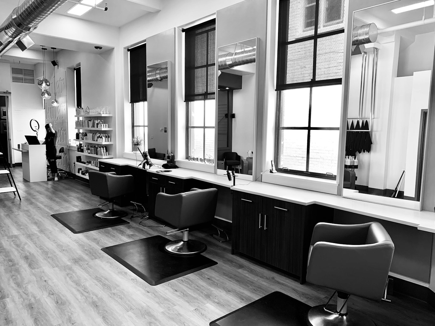 Modern salon interior with styling chairs and soft ambient lighting